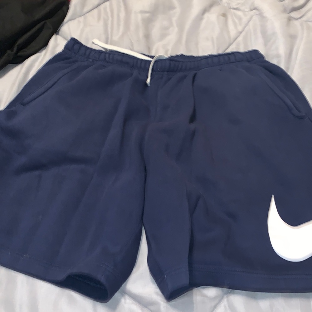 Mens blue Nike sweat shorts with white Nike check size large